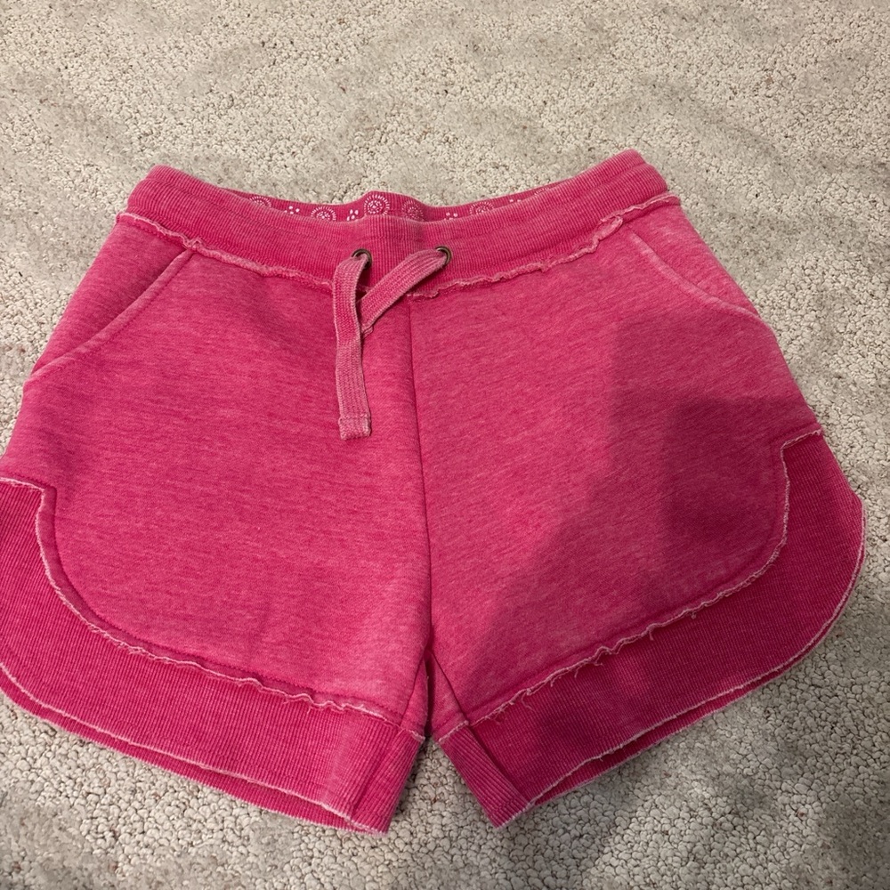 Pink Athletic Shorts with Drawstring Waistband and Curved Hem